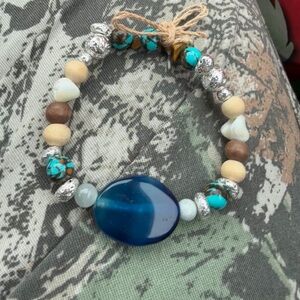 Handcrafted bracelet, raffia, wood, torquiose